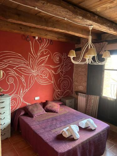 Ένα ή περισσότερα κρεβάτια σε δωμάτιο στο Casa Rural Teruel Alfambra LA DESHILLA