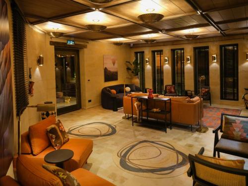 a large living room with couches and a table at Very Peri Cappadocia - The Lifestyle Luxury Design Hotel in Uchisar
