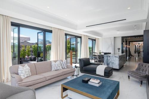 a living room with a couch and a table at The Aurum Collection by Totalstay in Cape Town