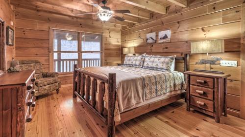 a bedroom with a bed in a log cabin at A Family Affair in Blue Ridge