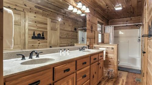 a bathroom with a large sink and a tub at A Family Affair in Blue Ridge