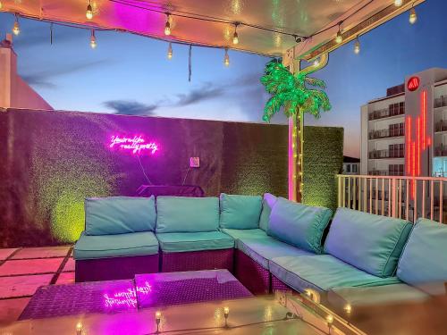 a living room with a couch on a patio at Vacay Spot experience Luna Sky! 65" TV BAR, BBQ, SHOWER massage jets, music, go to FL Keys in Homestead