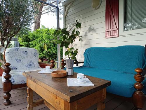 a blue couch and a coffee table on a porch at Villa Ardilla (La Adrada) in La Adrada