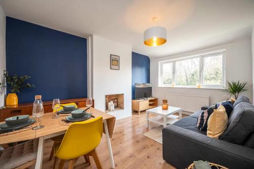 a living room with a couch and a table at Pass the Keys Modern Beckenham Apartment fast London train links in London