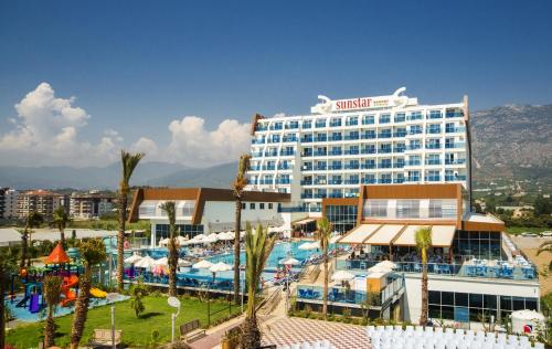 a hotel with a swimming pool and a resort at Sun Star Resort Hotel in Alanya
