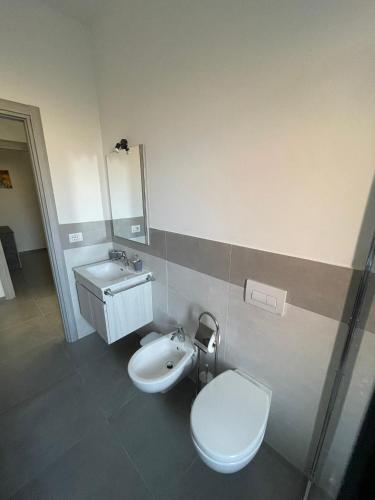 a bathroom with a toilet and a sink at Cloud's Home in Tropea