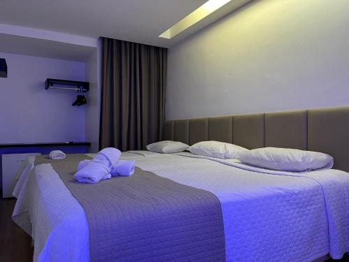 Ένα ή περισσότερα κρεβάτια σε δωμάτιο στο Mcz Hotel
