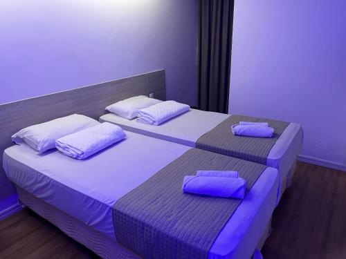 Ένα ή περισσότερα κρεβάτια σε δωμάτιο στο Mcz Hotel