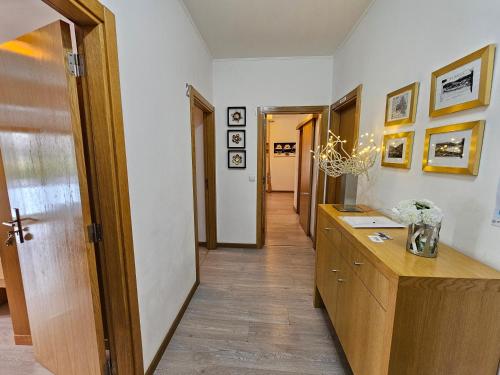 a hallway with a desk and a hallway leading into a room at Vistadouro 2 in Peso da Régua