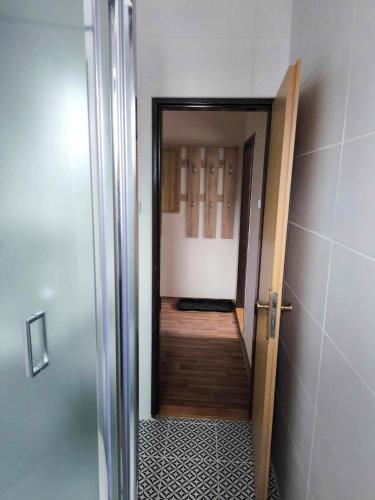 an open door to a room with a hallway at Penzion Betty in Okounov