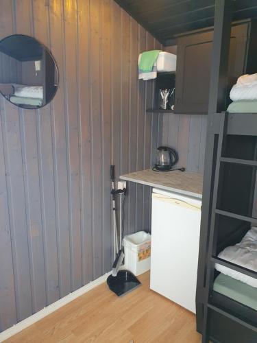 a small room with a kitchen and a bunk bed at Bjørgebu Camping AS in Mysusæter