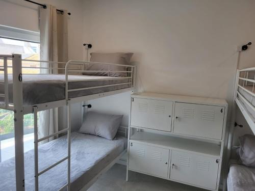 Ένα ή περισσότερα κρεβάτια σε δωμάτιο στο HostelCCPortimão