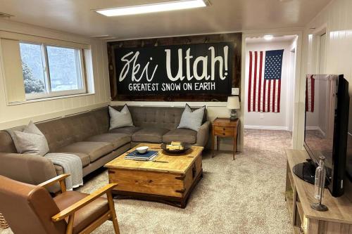 a living room with a couch and a coffee table at Cozy Mountain Retreat in Morgan