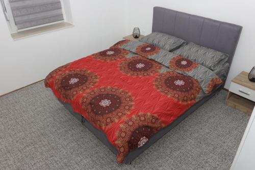 Ένα ή περισσότερα κρεβάτια σε δωμάτιο στο Apartman Dunja