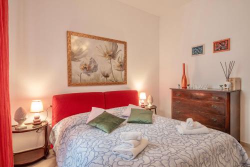 Кровать или кровати в номере Piombino Apartments - Casa Dini