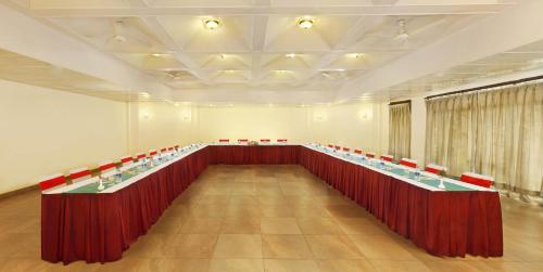 a conference room with a long table and red chairs at Sterling Mussoorie in Mussoorie