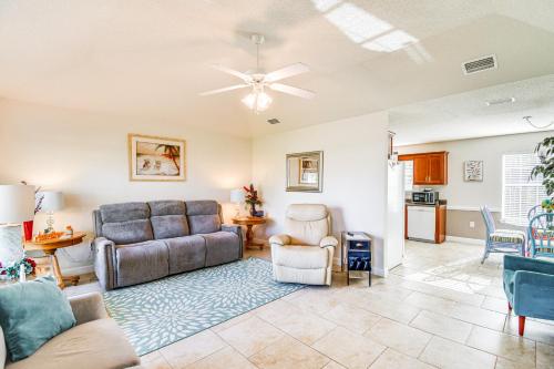 a living room with a couch and a table at Foley Getaway with Fenced Yard - 13 Mi to Beaches! in Foley