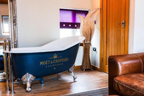 a blue and white bath tub in a living room at Harrys lounge in Whitby