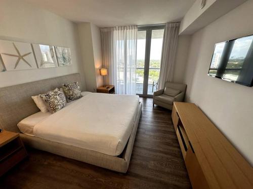 Ένα ή περισσότερα κρεβάτια σε δωμάτιο στο Waterfront Beach Apartment