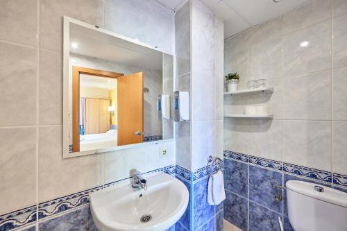 a bathroom with a sink and a mirror at AHOI! Urban Beach in Palma de Mallorca