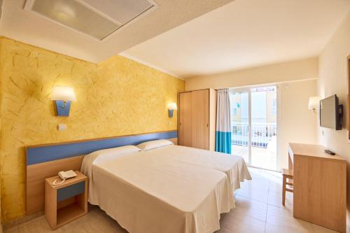 a hotel room with a bed and a window at AHOI! Urban Beach in Palma de Mallorca