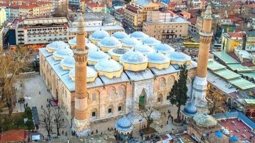 a large building with a mosque in a city at URAZ Suit Otel in Bursa