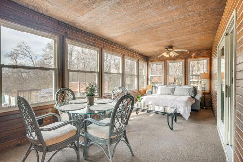 a room with a bed and a table and chairs at Pet-Friendly Ohio Escape with Pool, Deck and Fire Pit! in Mount Vernon