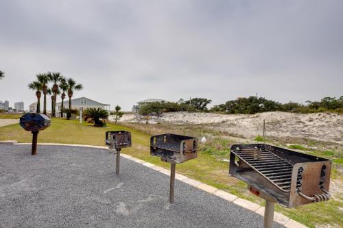 a group of three barbecue equipment on the street at Gulf Shores Condo with Balcony 2 Mi to Fort Morgan! in Gulf Shores