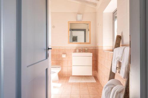 a bathroom with a toilet and a sink at Il Querceto by Great Stays in Città della Pieve
