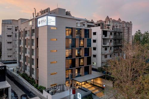 an apartment building in a city with buildings at SKYLA Studios & Suites - Kondapur in Hyderabad