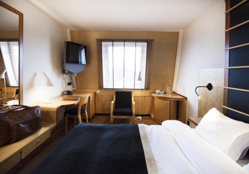 TV a/nebo společenská místnost v ubytování Hotel Lundia