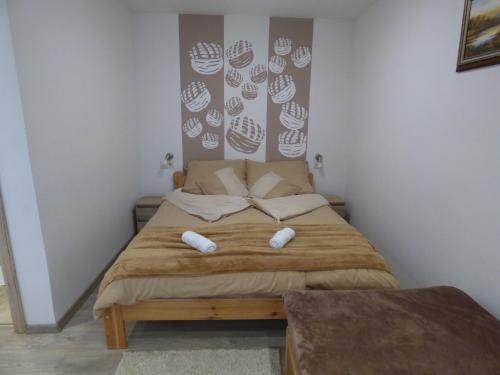 Katil atau katil-katil dalam bilik di Pogácsás Apartman
