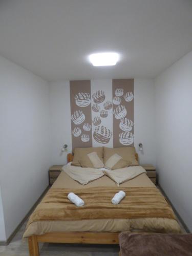 Katil atau katil-katil dalam bilik di Pogácsás Apartman