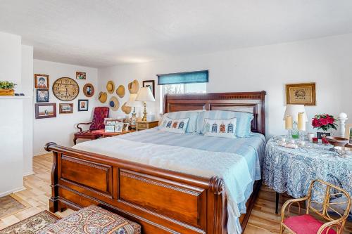 a bedroom with a bed and a table and chairs at Mountain Vista - Barn in Hesperus