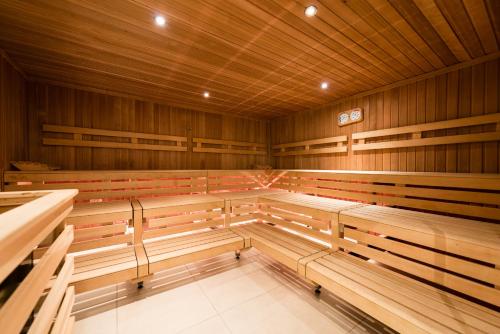 a large empty lecture room with wooden benches at Landhotel Burg im Spreewald - Resort & Spa in Burg