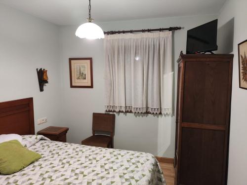 Postel nebo postele na pokoji v ubytování Hotel Azkue