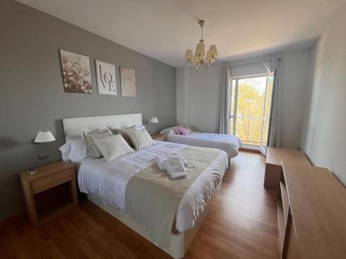 Giường trong phòng chung tại Encanto Comillas