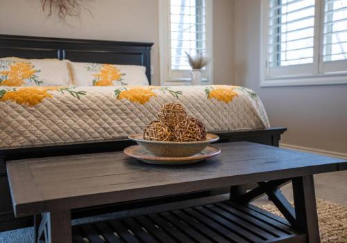 a coffee table with a bowl of food on top of a couch at Scenic Hills in North Salt Lake