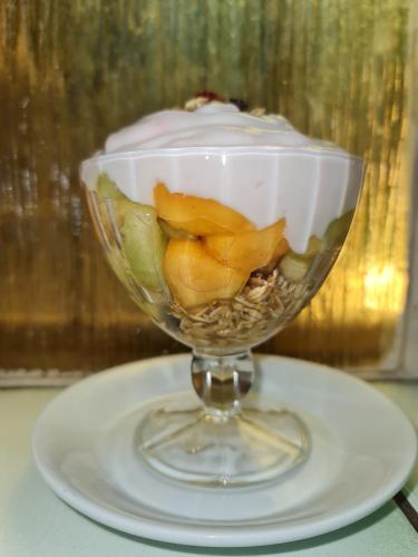 a glass bowl filled with a dessert on a plate at Capital Hill Stay at Spa in Pretoria