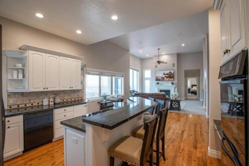 a kitchen with white cabinets and a counter top at Scenic Hills in North Salt Lake