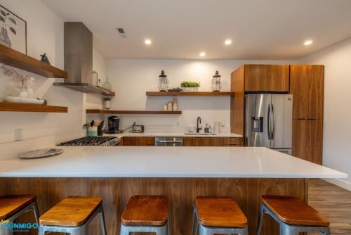 a kitchen with a white counter and wooden cabinets at Navien Nooks Unit 3 in Salt Lake City