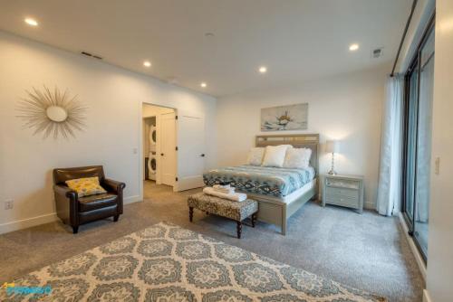 a bedroom with a bed and a chair at Navien Nooks Unit 3 in Salt Lake City