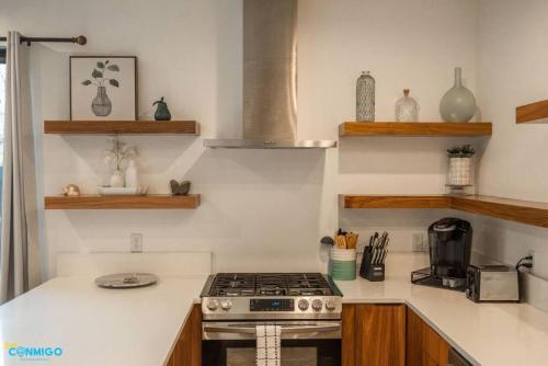 a kitchen with a stove and a counter top at Navien Nooks Unit 3 in Salt Lake City