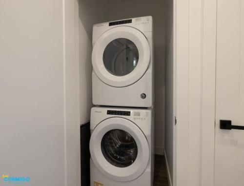 a washing machine and a dryer in a room at Navien Nooks Unit 3 in Salt Lake City