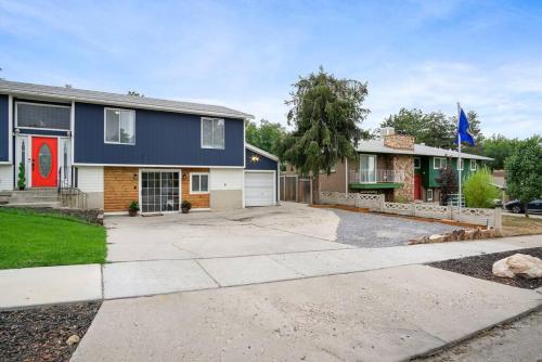 a house with a driveway and a garage at Grumpy Grizzly in Sandy