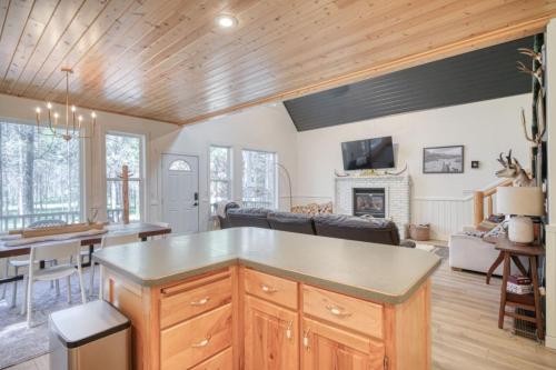 a kitchen and living room with a table and a couch at Bills Island Hideaway in Island Park