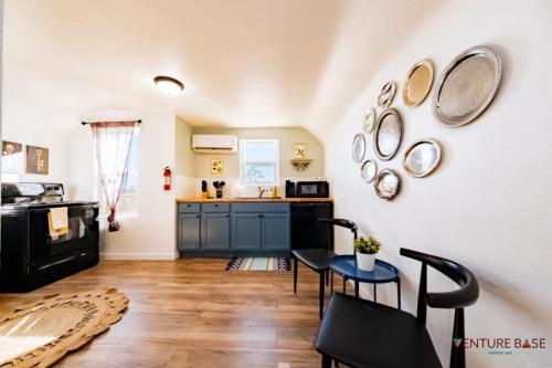 a kitchen with a table and chairs in a room at Trailblazer's Retreat, Venture Base Unit 3 in Kanab