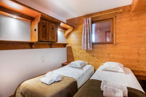Posteľ alebo postele v izbe v ubytovaní Résidence Les Alpages de Chantel - maeva Home - Appartement 4 Pièces 8 Personnes - Sélection MAE-1649