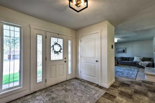 a living room with a door and a couch at Riverview Retreat in Idaho Falls