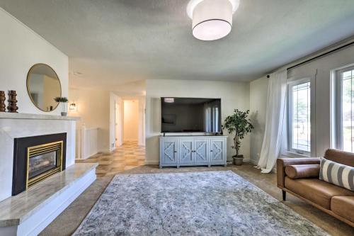 a living room with a fireplace and a television at Riverview Retreat in Idaho Falls
